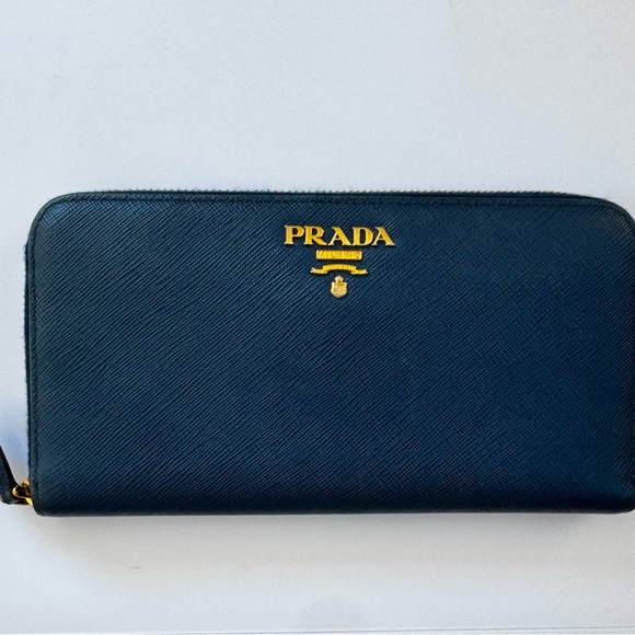 Prada Handbags - Excellent Blue Prada Zip-Around Wallet with Gold Accents